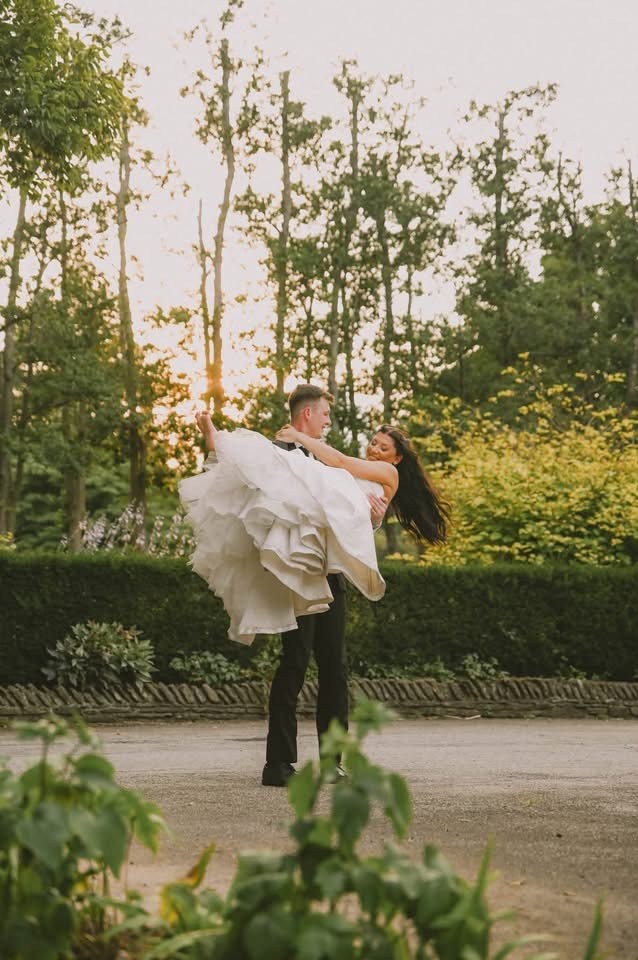 Newlyweds celebrating outdoors at sunset